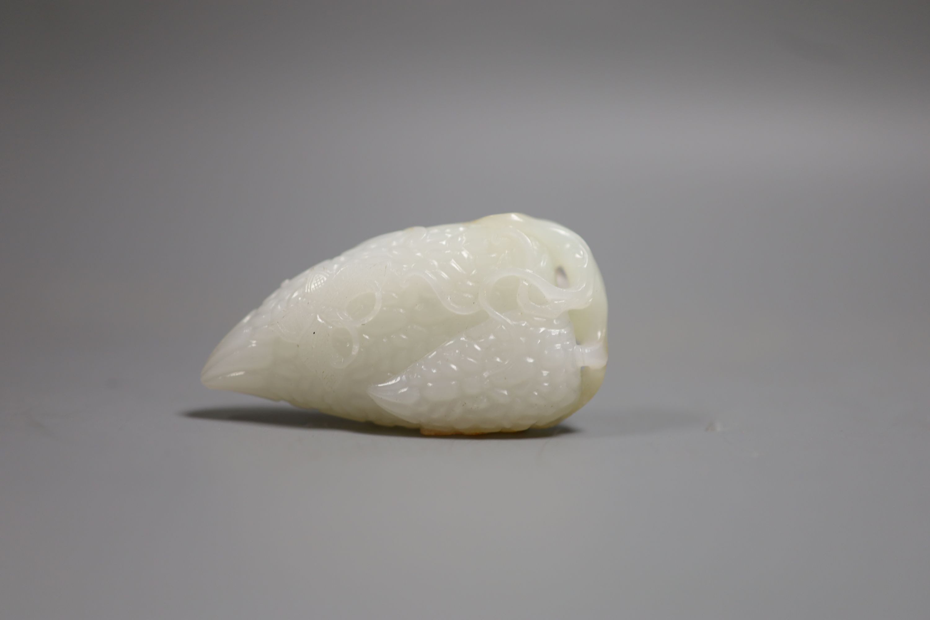 A Chinese white and russet skin jade carving, 7cm high